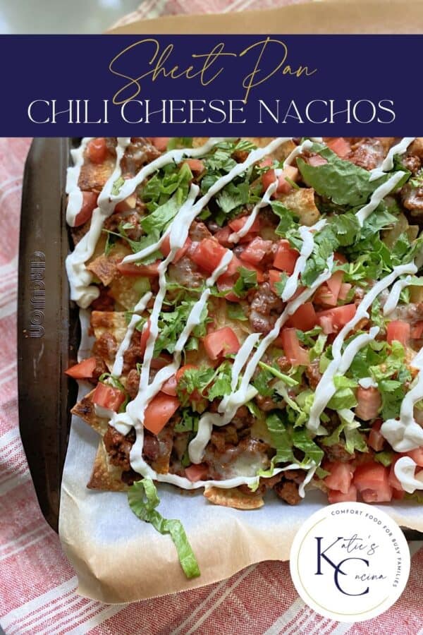Top view of a brown sheet pan filled with chili cheese nachos with text on image for Pinterest.