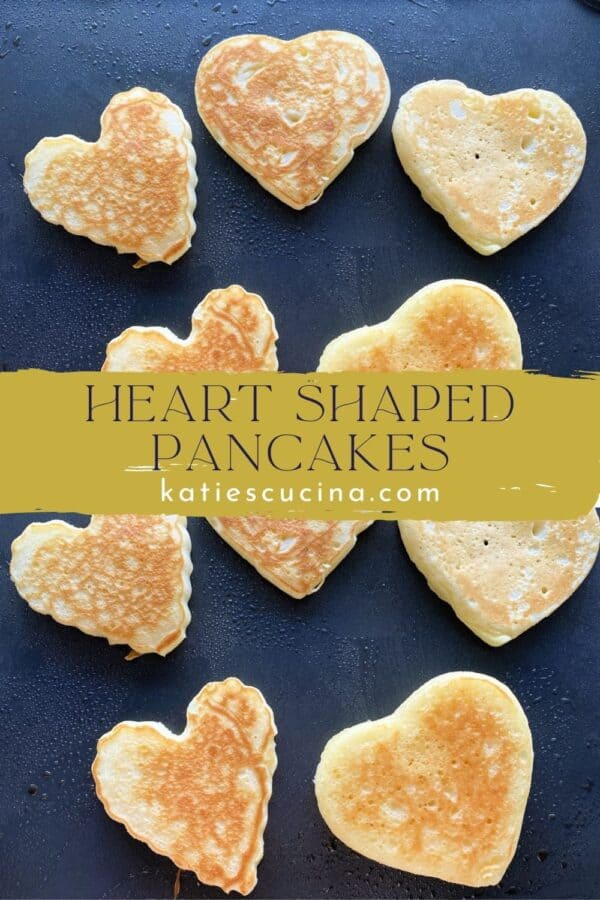 A photo of heart shaped pancakes on a griddle with text splitting images.