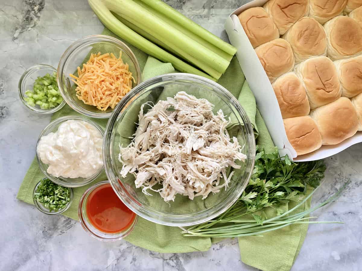 Ingredients: Kings Hawaiian Rolls, celery, cheese, mayonnaise, buffalo sauce, shredded chicken, celery, chives.