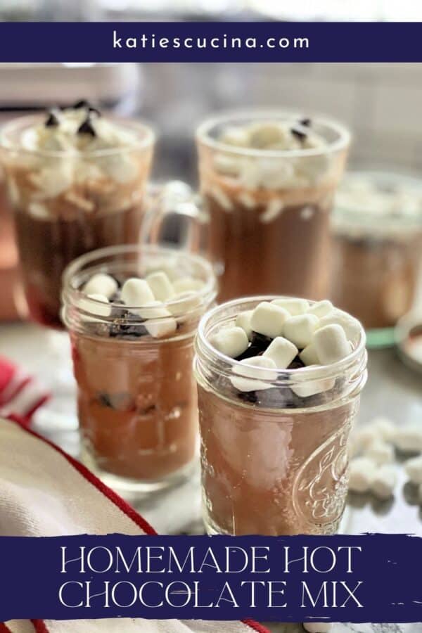 Two mason jars filled with hot chocolate mix with text on image for Pinterest.