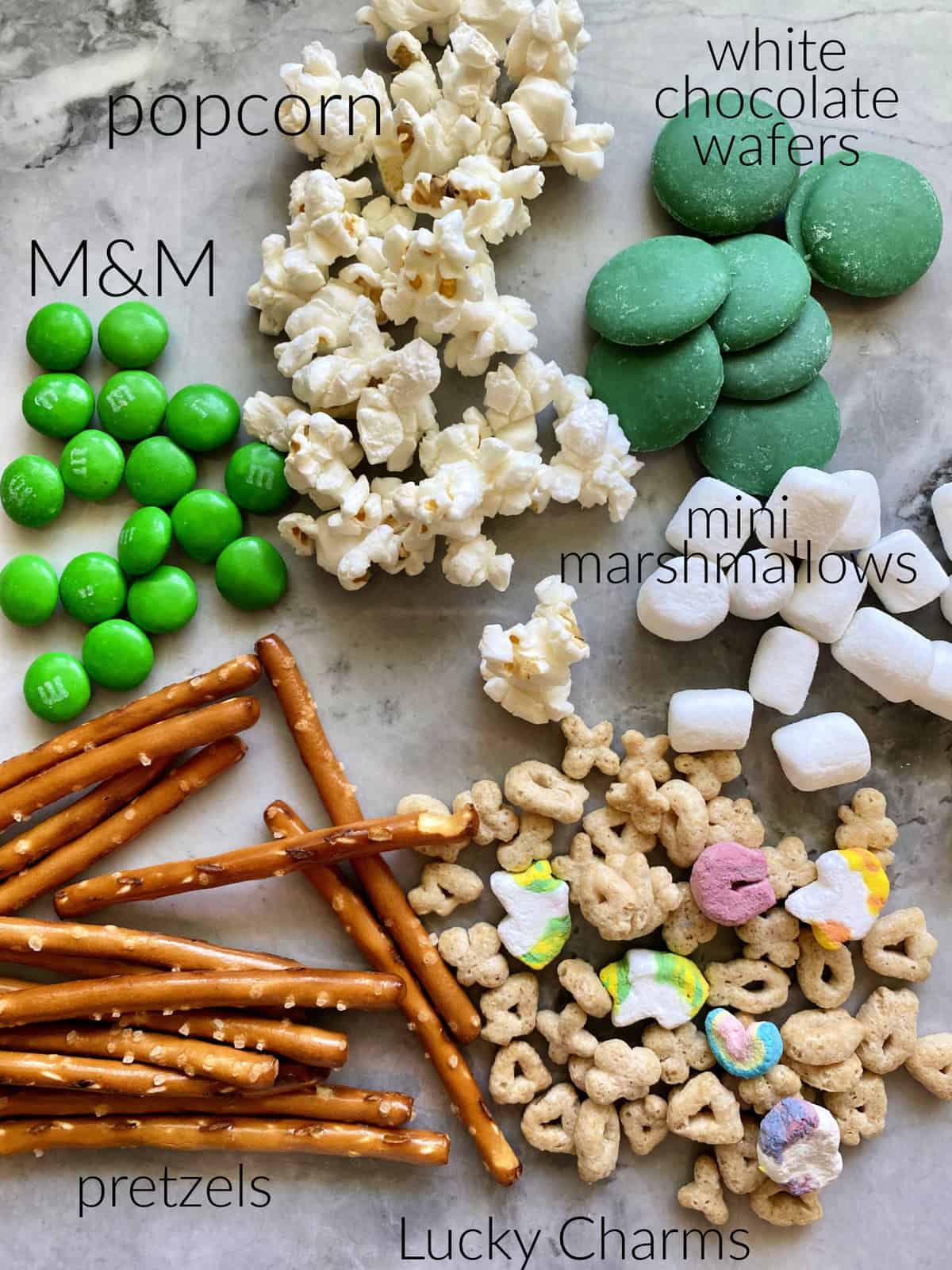 Ingredients: popcorn, M&M, pretzels, lucky charms, white chocolate wafers, and mini marshmallows.