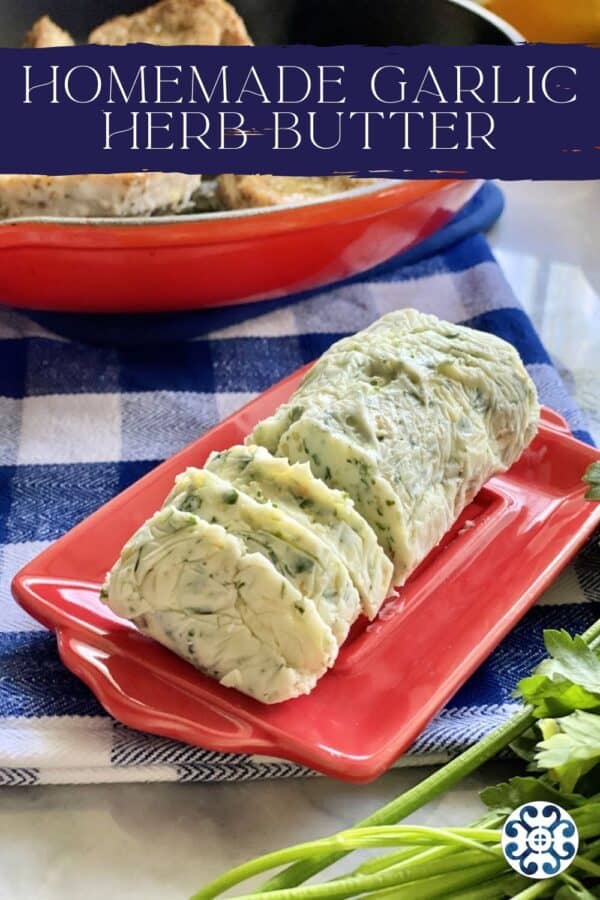 Red plate with a log of Garlic Herb Butter with text on image for Pinterest.