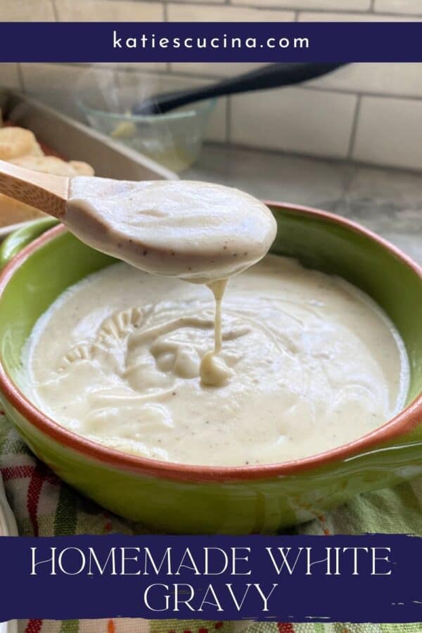 Wooden spoon drizzling white gravy into a green bowl full of white gravy with text on image for Pinterest.