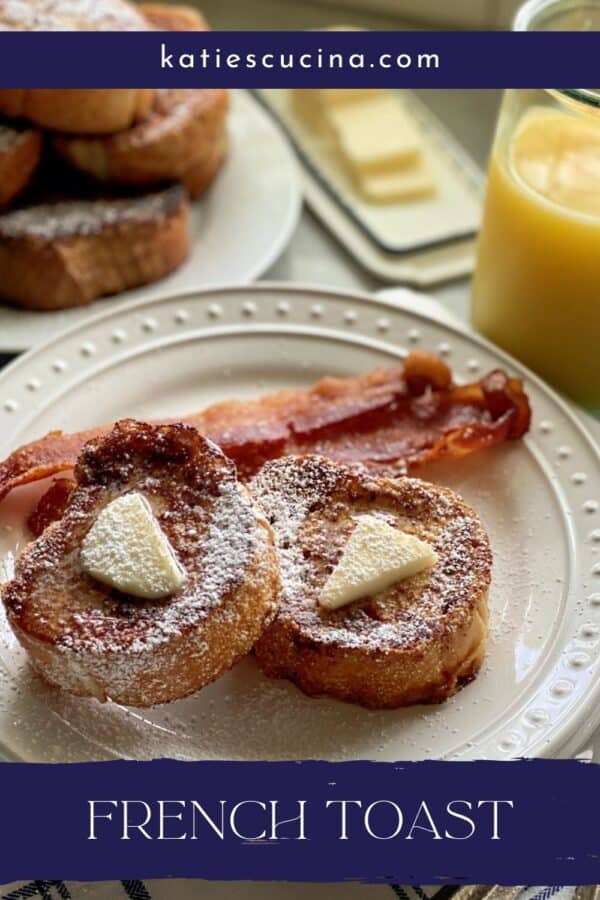 Two slices of french toast with butter and powder sugar on a white plate with recipe title on image for Pinterest.