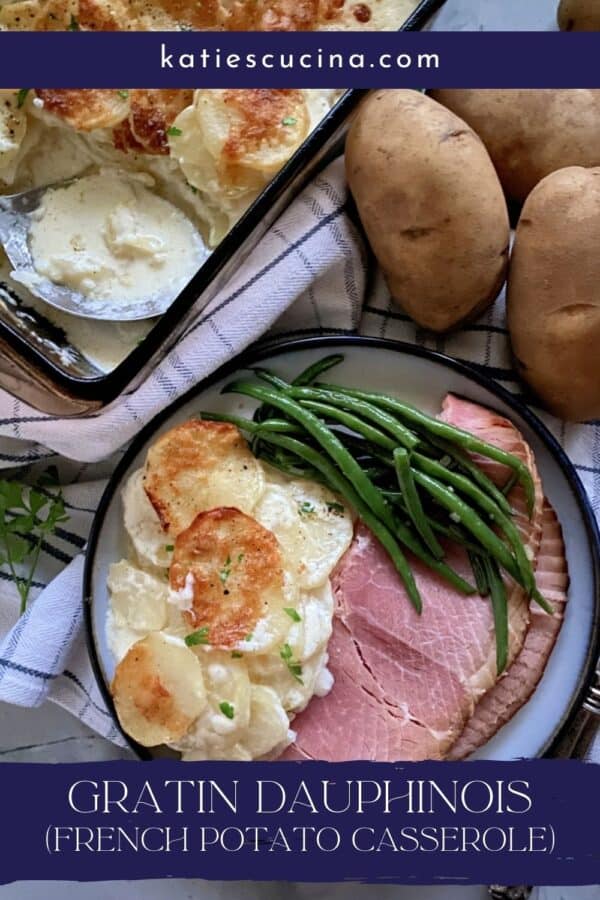 Top view of a plate of Gratin Dauphinois potatoes, green beans, and ham.