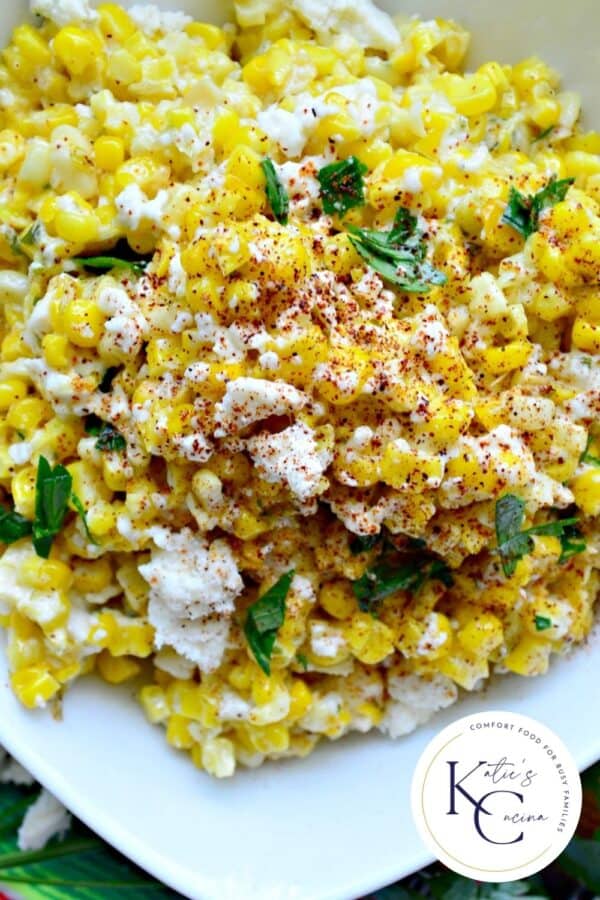 Close up of Mexican Street Corn Salad in a white bowl with logo on right corner.