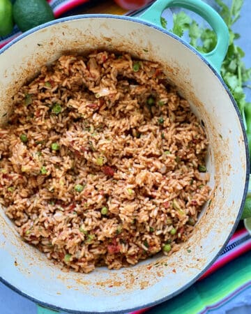 Top view of a greep pot filled with Mexican Rice with vegetables.