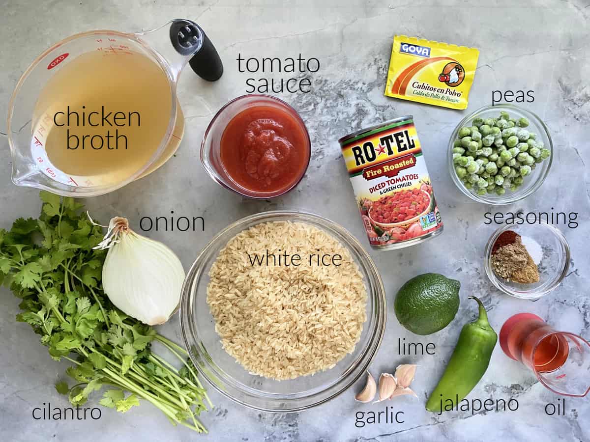 Ingredients: broth, onion, cilantro, tomato sauce, white rice, garlic, lime, jalapeno, oil, seasoning, peas, rotel, and goya.