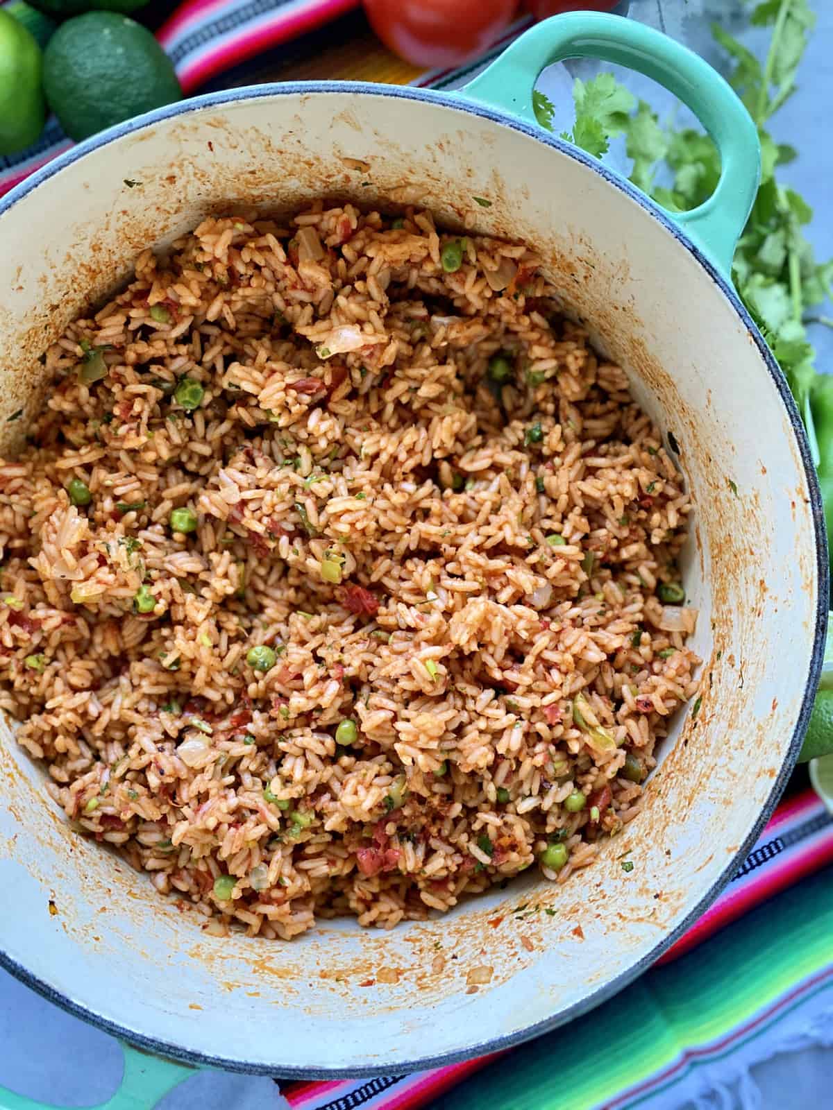 Top view of a greep pot filled with Mexican Rice with vegetables.