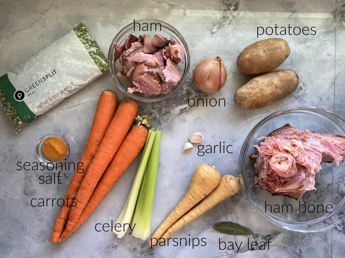 Ingredients: split peas, seasoning salt, carrots, celery, parsnips, bay leaf, garlic, onion, ham, onion, potatoes, and ham bone.