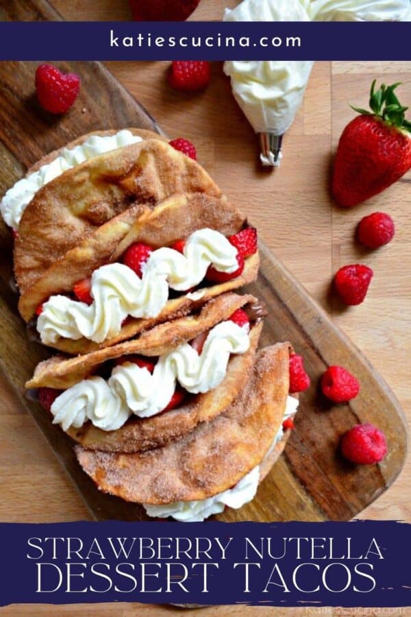 Top view of a wooden board with Strawberry Nutella Dessert Tacos with recipe title text on image.