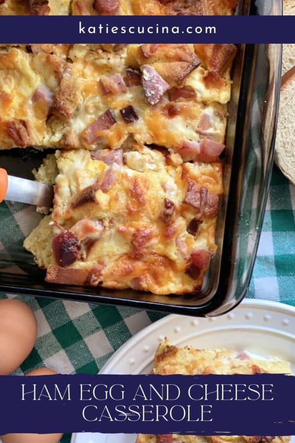 Top view of a slice of breakfast casserole being lifted out of a dish with text on image for pinterest.