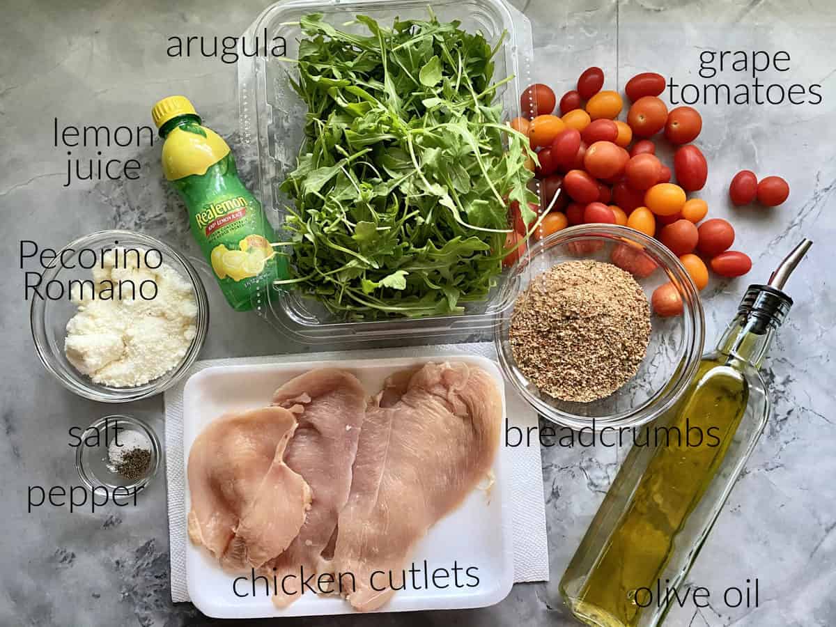 Ingredients: chicken cutlets, salt, pepper, oil, lemon juice, argula, tomatoes, breadcrumbs, and pecorino romano cheese.