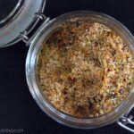 Top view of a glass jar filled with a seasoning.