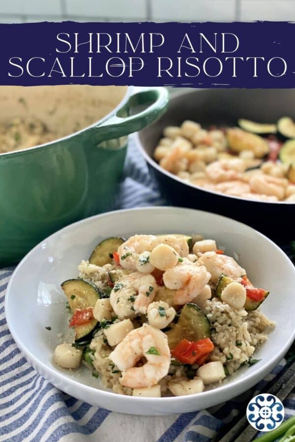 White bowl filled with risotto, seafood, and vegetables with text on image for Pinterest.