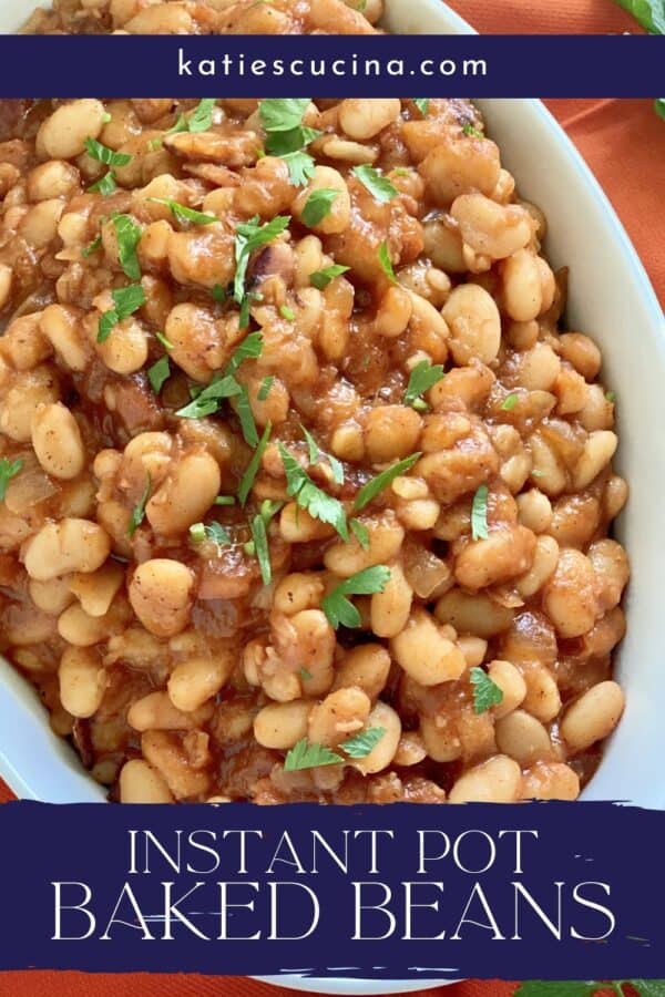 Close up of a white oval bowl filled with baked beans with text on image for Pinterest.