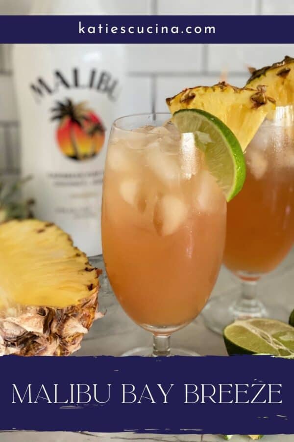 Two glasses of bay breeze with Malibu Rum with text on image for Pinterest.