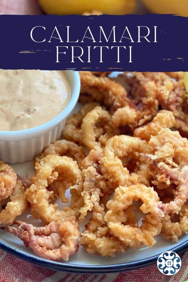 Close up of a fried calamari on a white plate with dipping sauce with recipe title text on image for Pinterest.