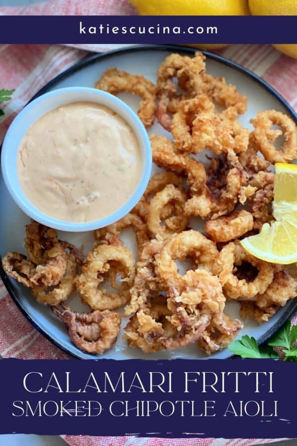 Top view of a white plate filled with calamari and dipping sauce with recipe title text on image for Pinterest.