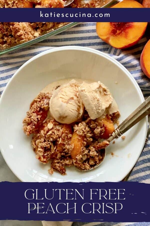 Top view of a shallow white bowl filled with peach crisp, ice cream, and a spoon with recipe title text on image for Pinterest.