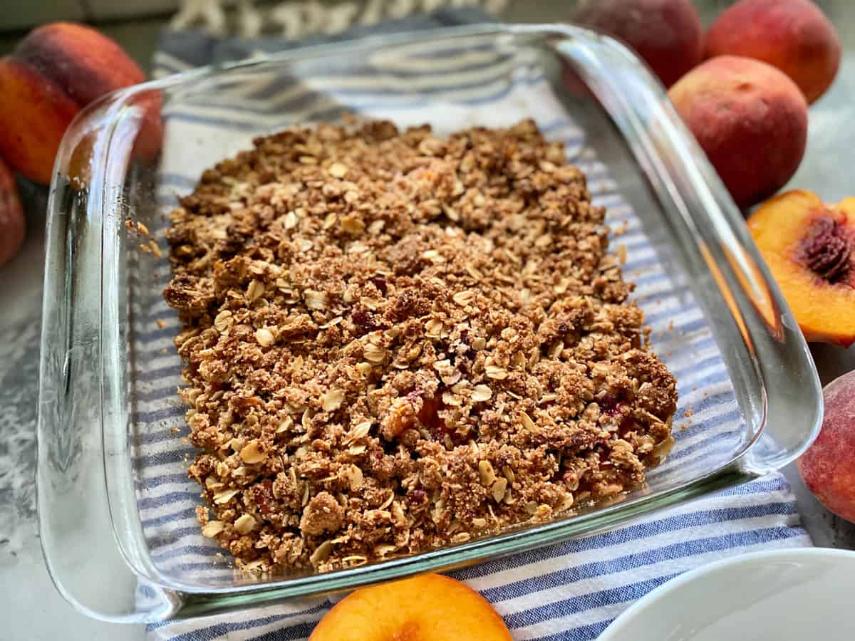 Square glass baking dish with crisp topping.