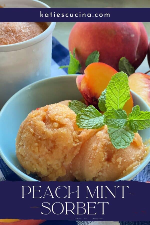 Blue bowl filled with peach sorbet with fresh peaches in background with recipe title text on image for Pinterest.