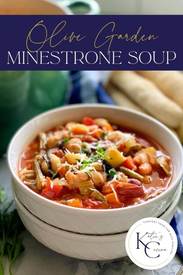 White bowls stacked with minestrone soup with recipe title text on image for Pinterest.