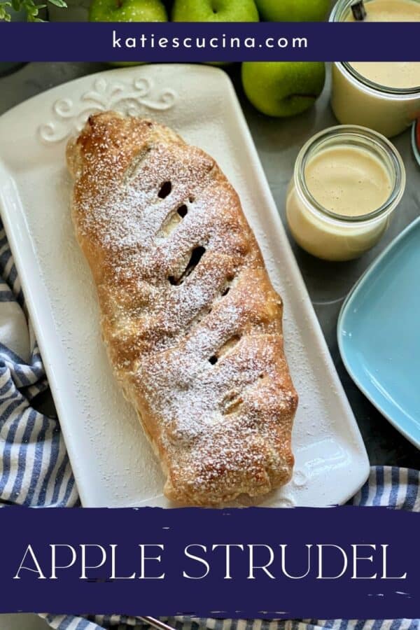 White platter with a Apple Strudel with powder sugar with recipe title on image for Pinterest.