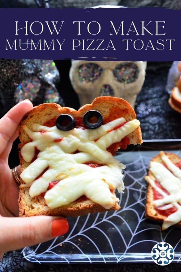 Hand with orange fingernails holding a slice of pizza toast with recipe title text on image for Pinterst.