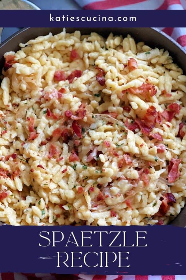 Top view of a skillet full of bacon and spaetzle with recipe title text on image.