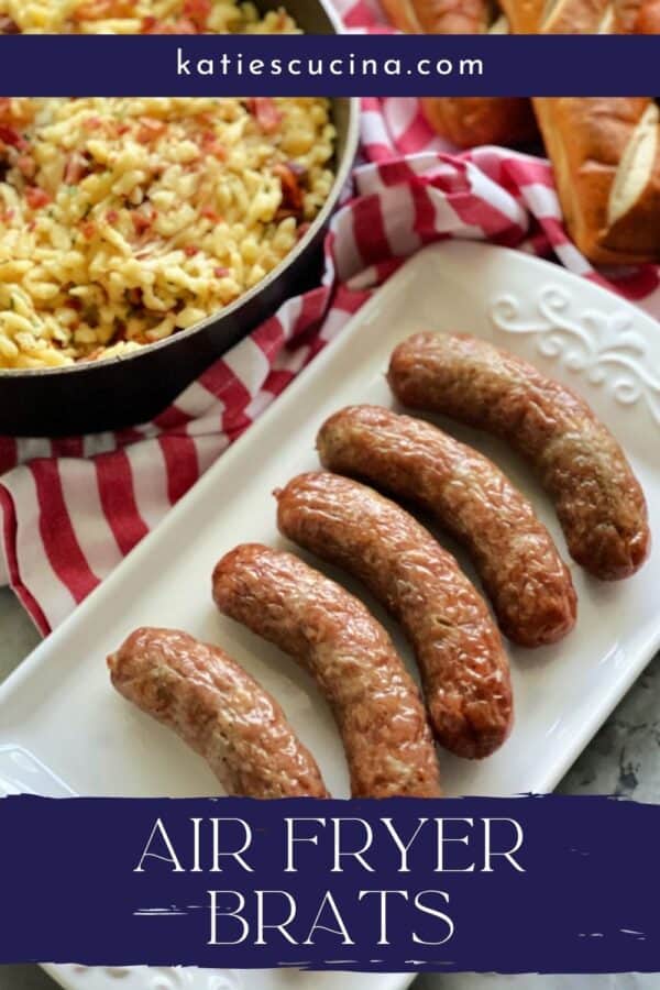 Top view of a white platter filled with brats and recipe title text on image for Pinterest.