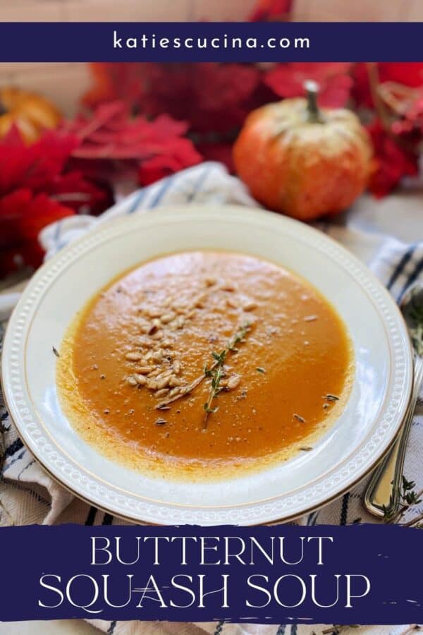 White bowl filled with squash soup with recipe title text on image.