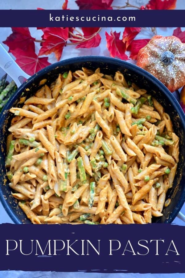 Top view of a skillet of creamy pasta with recipe title text on image for Pinterest.