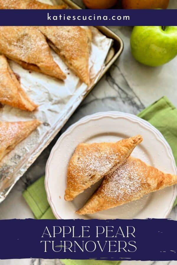 Top view of two turnovers on a white plate with four on a baking sheet and recipe title text on image.