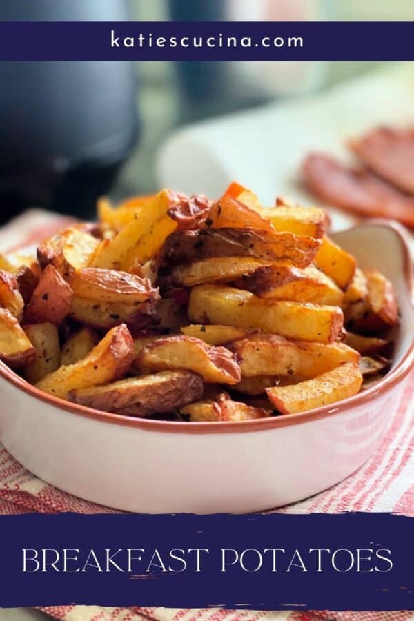 White dish with fried breakfast potatoes inside sitting on red and white towel, Title text on bottom