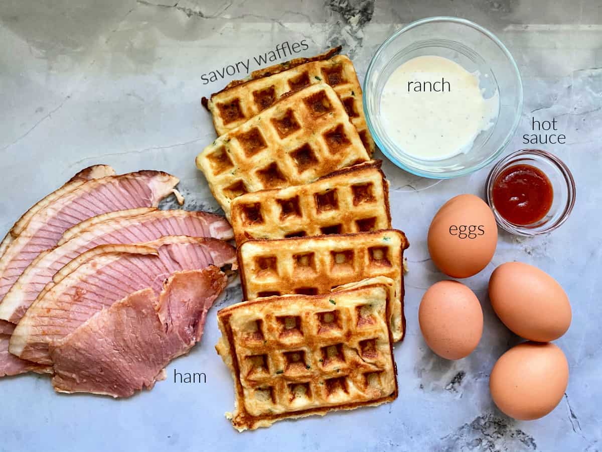 Ingredients; ham, savory waffles, ranch dressing, eggs, and hot sauce.