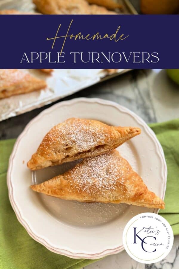 Top view of two turnovers on a white plate with recipe title text on image for Pinterest.