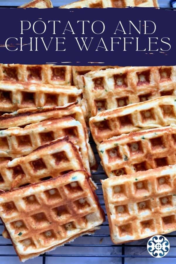 Top view of waffles stacked on wire rack with recipe title text on image for Pinterest.