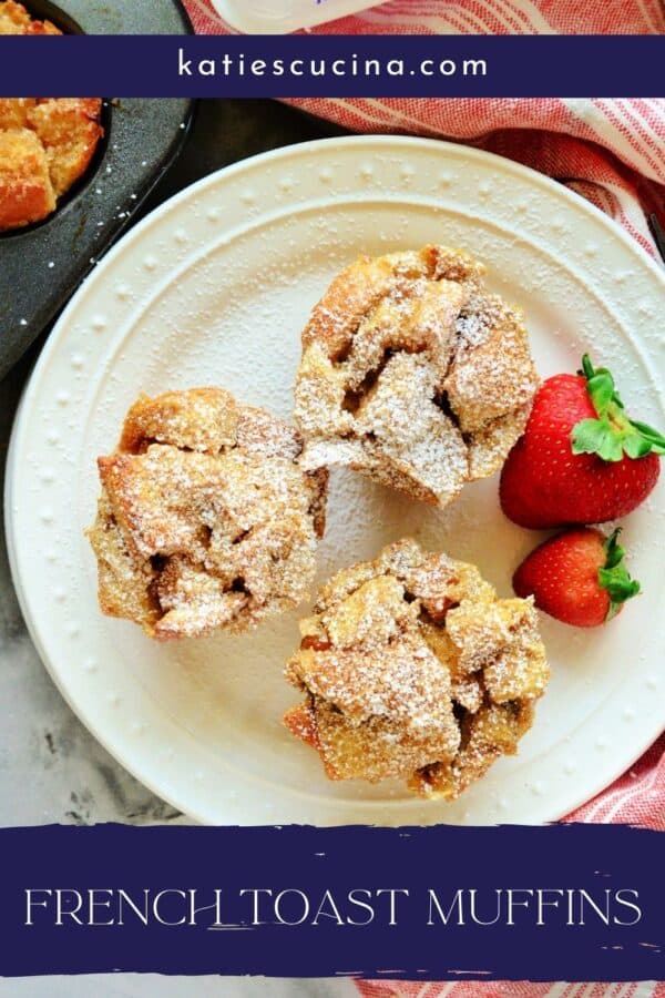 Top view of french toast muffins with powdered sugar and fruit on white plate with title text on bottom
