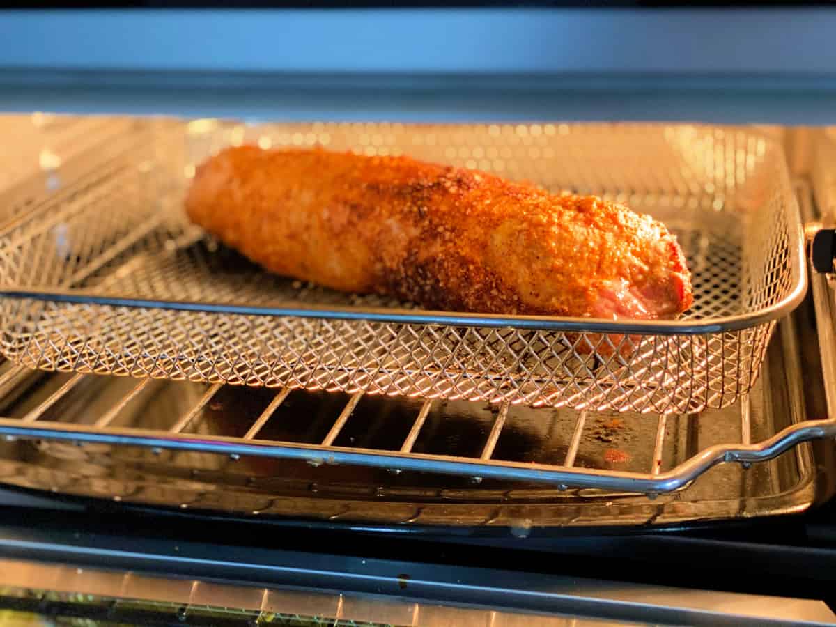 Pork tenderloin on wire rack in air fryer