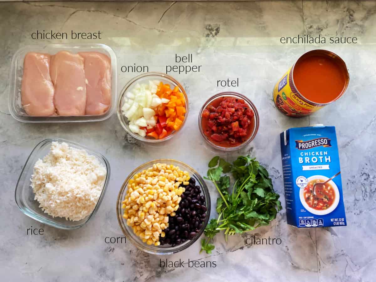 Recipe ingredients: chicken breast, rice, corn & black beans, cilantro, onion & bell pepper, rotel, enchilada sauce, and chicken broth