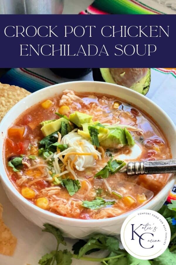 Chicken enchilada soup in white bowl with spoon, title text above