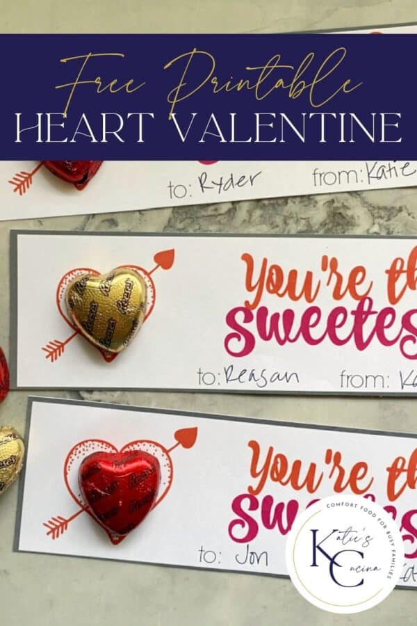 Close up of two valentine's with chocolate heart candies with post title on image for Pinterest.