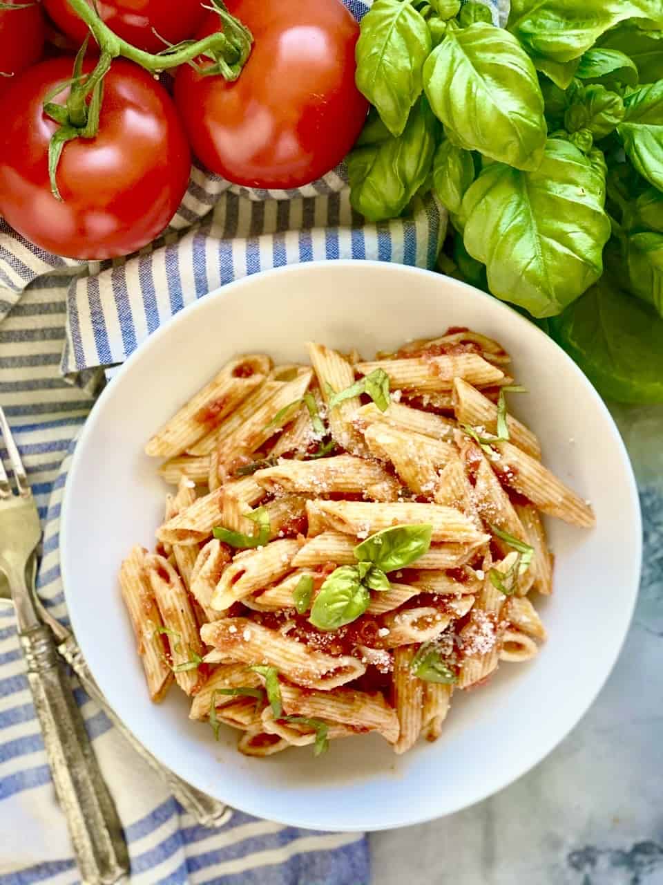 Top view of the penne pomodoro in a white pasta plaate