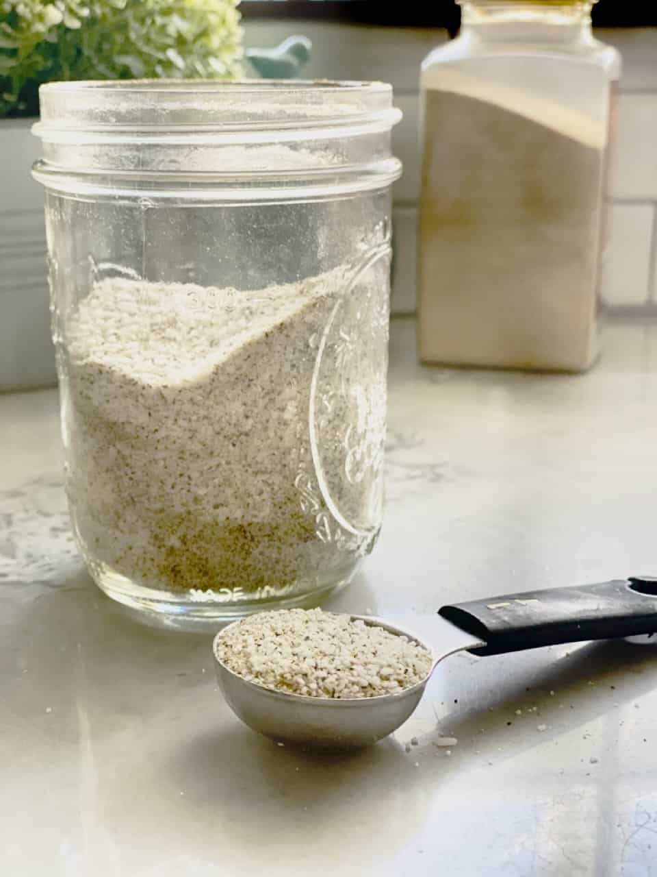 House seasoning in glass jar and in 1 tablespoon
