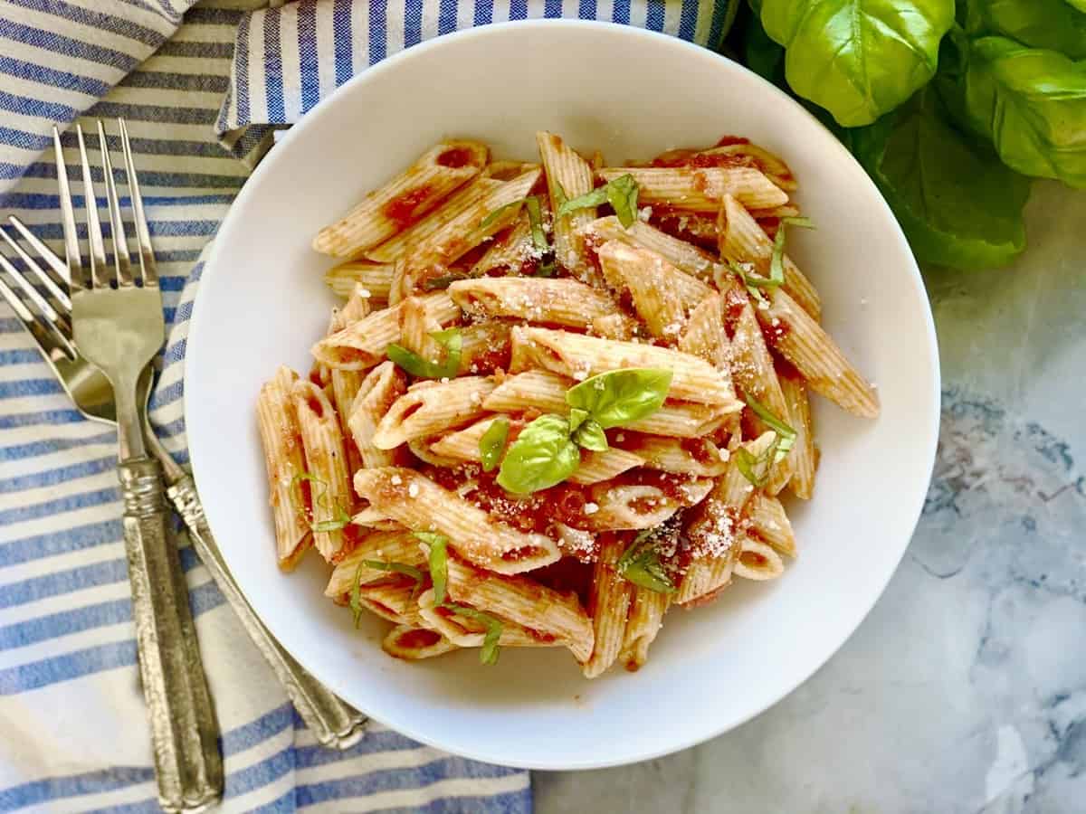 Top view of the penne pomodoro in a white pasta plate