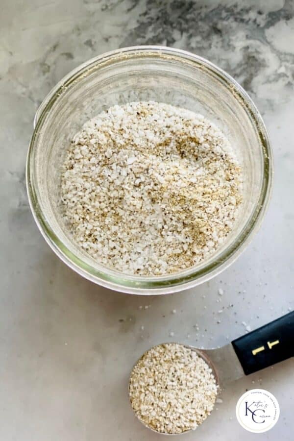 Top view shot of house seasoning in mason jar with tablespoon full to the side