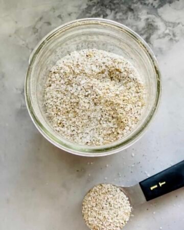 glass bowl and tablespoon filled with house seasoning