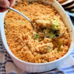 Broccoli Cheese Casserole spooned out of white baking dish
