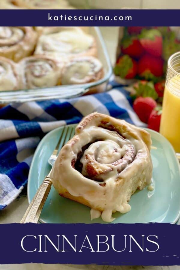 Cinnamon rolls on a plate with recipe title text on image for Pinterest.